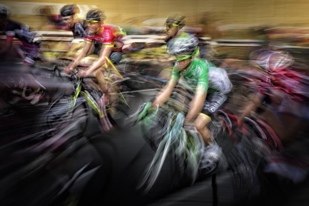Speeding Velodrome Cyclists by Oskar Baglietto — canvas wall art