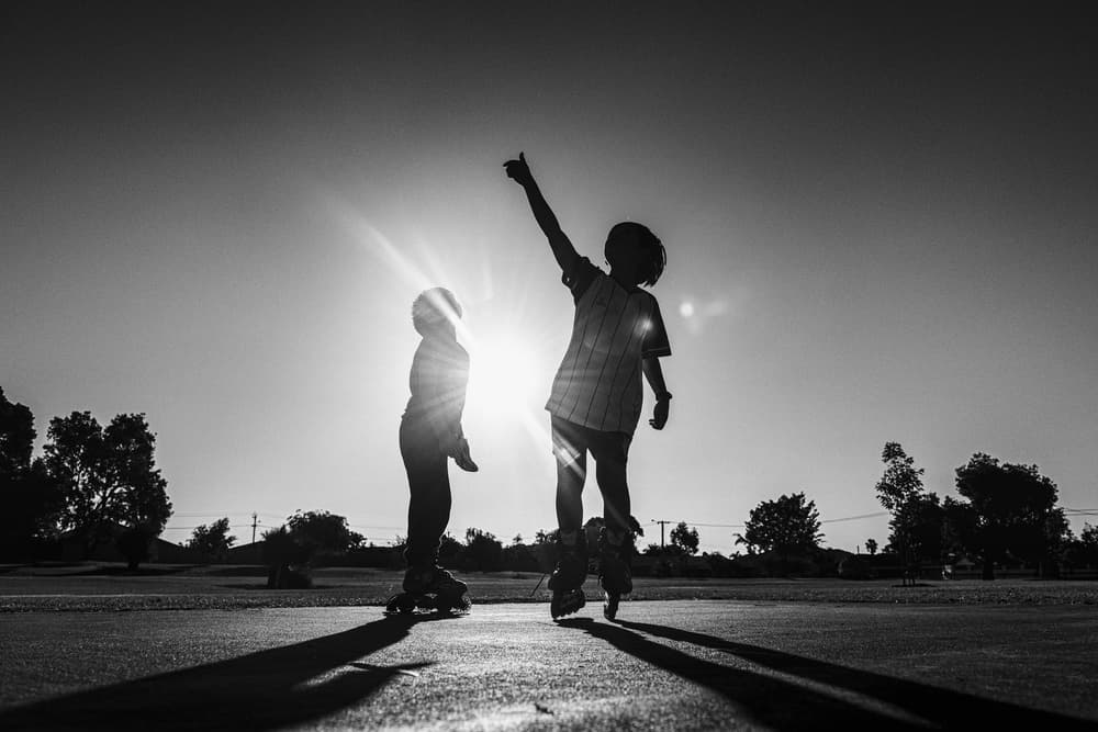 Joyful Sunset Skaters by Despird Zhang — canvas wall art