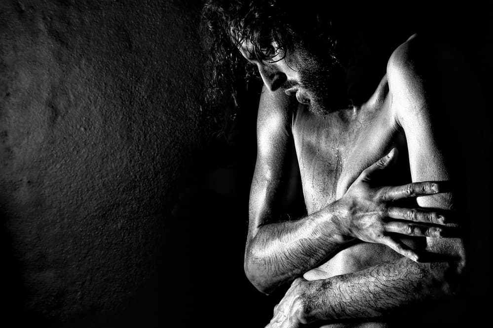Pensive Man in Darkness by Paulo Medeiros — canvas wall art