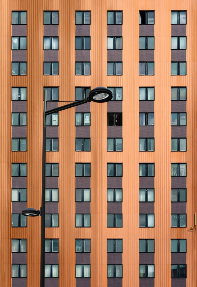 Geometric Orange Building by Karim Al Thahaby — canvas wall art