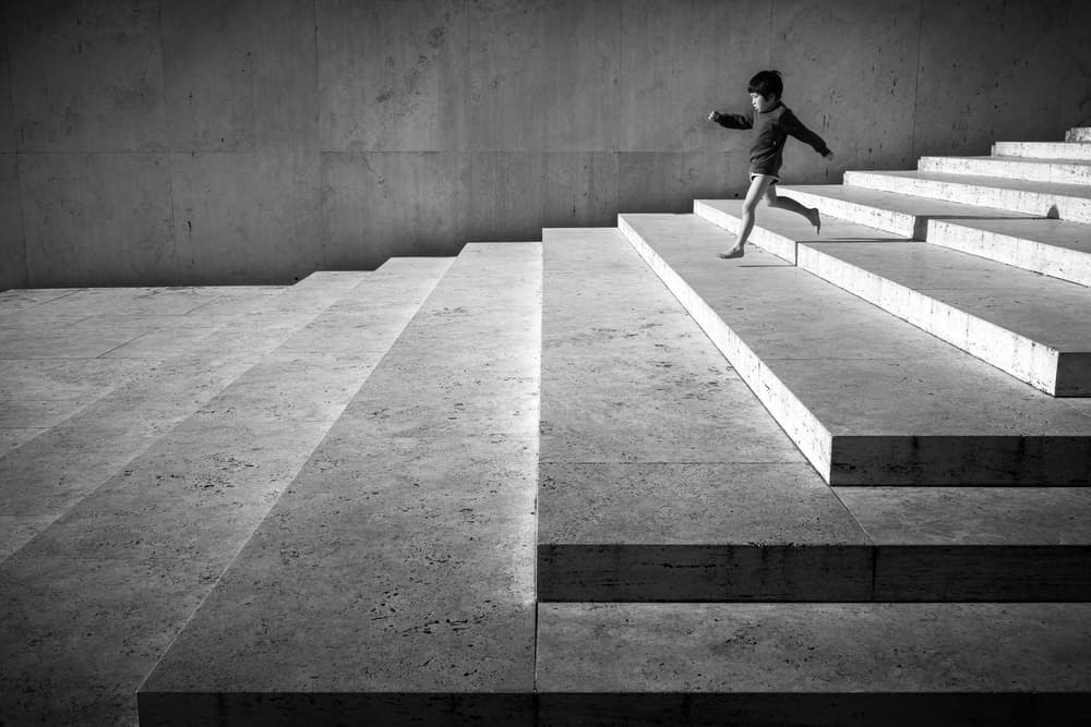 Running Boy On Stairs by Riccardo Lucidi — canvas wall art