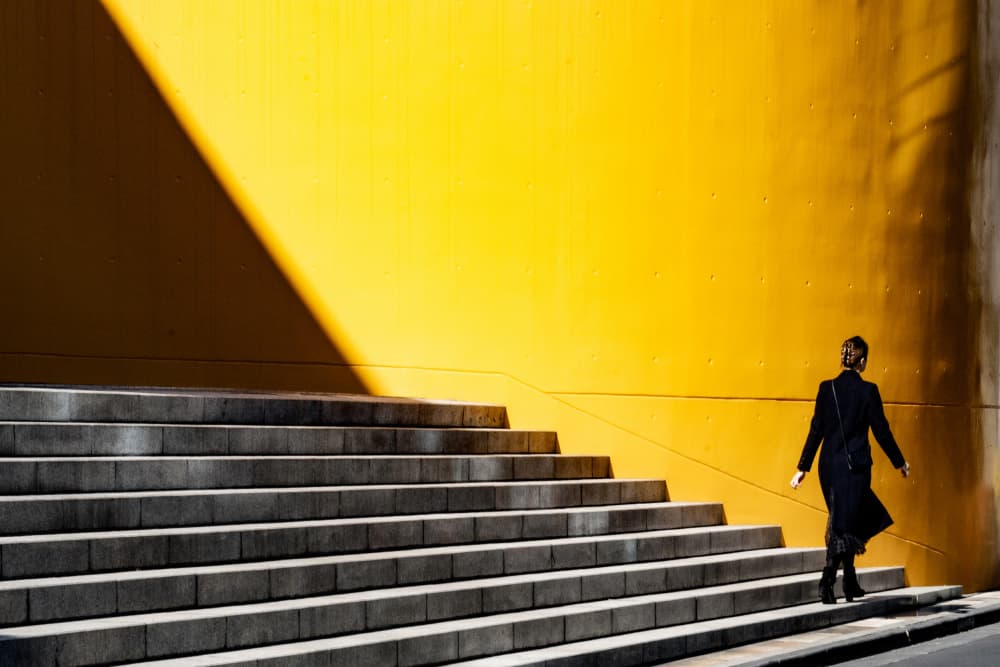 Woman on Yellow Steps by Linda Wride — canvas wall art