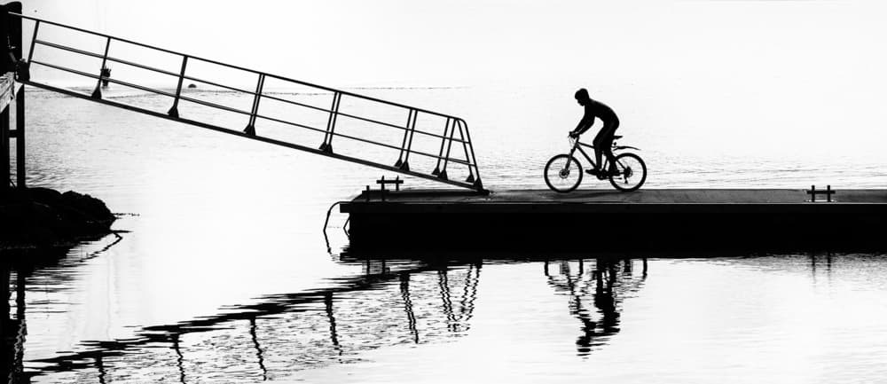 Reflected Bike Ride by Julien Oncete — canvas wall art