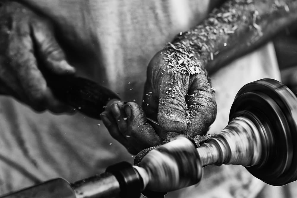 Artisan Hands Crafting Wood by Manu Allicot — canvas wall art