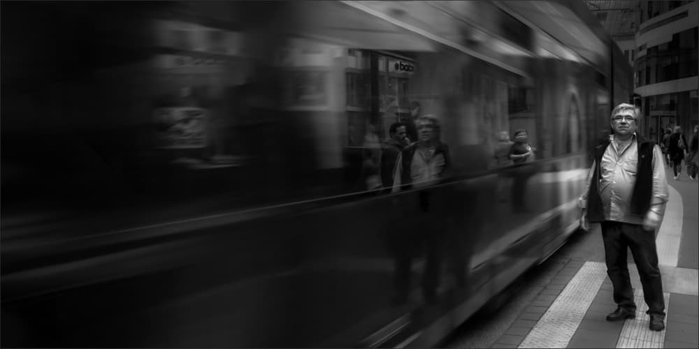 Man and Moving Train by Gilbert Claes — canvas wall art