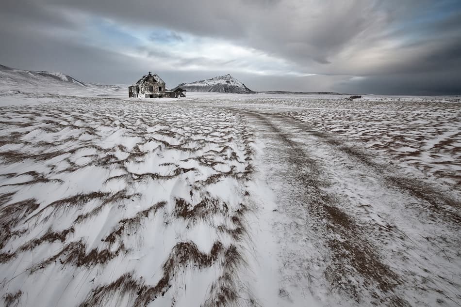 Abandoned Winter Farmhouse Road by Bragi Ingibergsson - BRIN — canvas wall art
