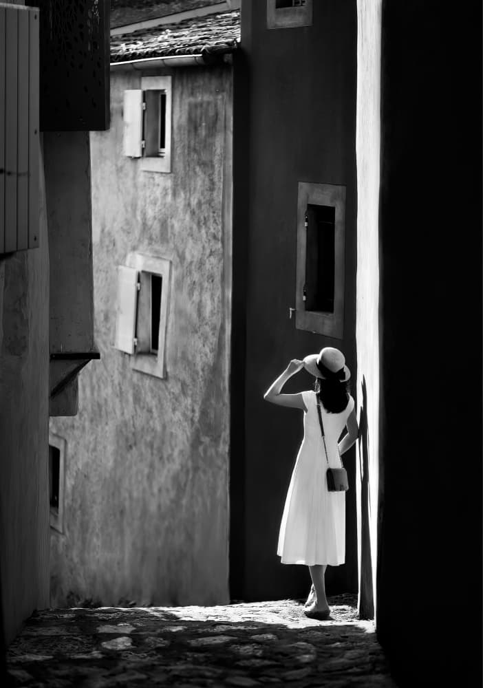 Woman in Sunlit Alley by Kenneth-Wei Zeng — canvas wall art