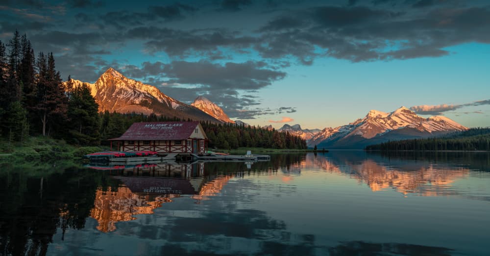 Maligne Lake Boathouse Reflection by Bing Li — canvas wall art