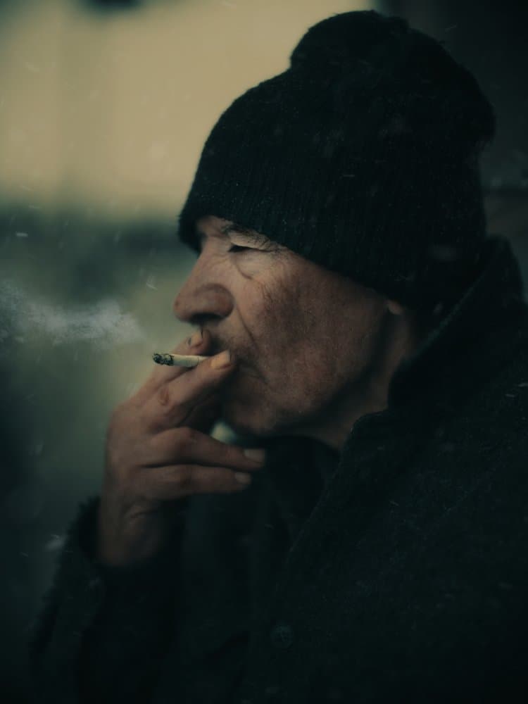 Man Smoking Outdoors by Koki Jovanovic — canvas wall art