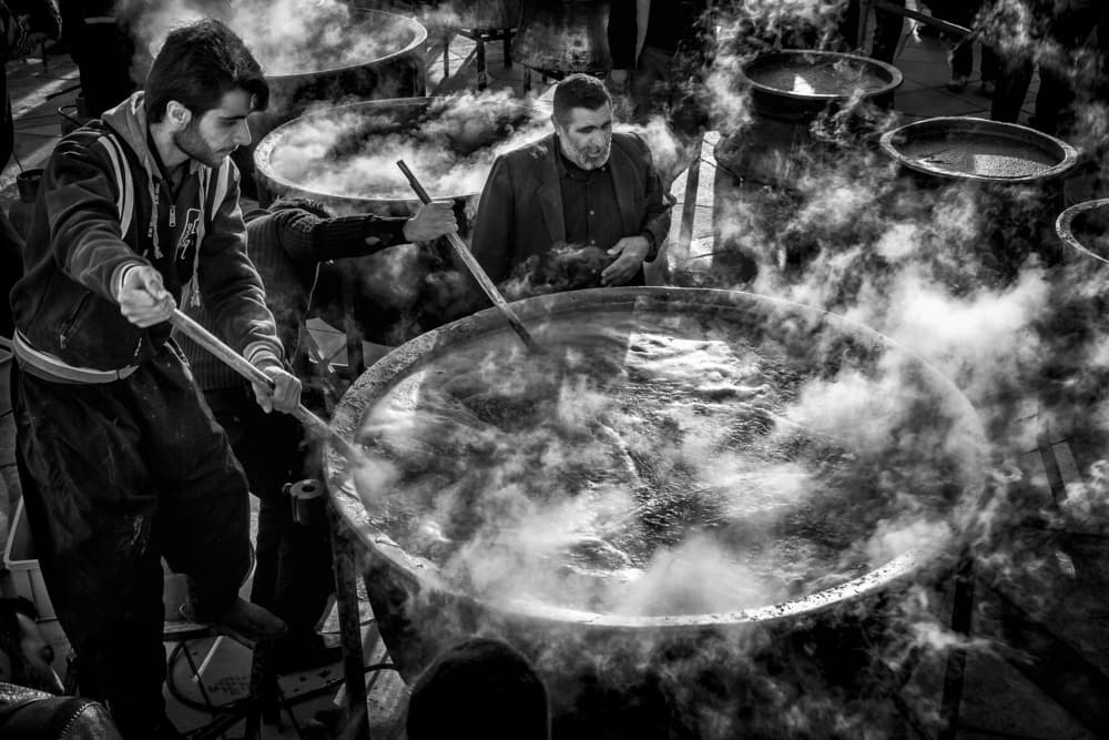 Men Stirring Steaming Pots by Mohammadreza Momeni — canvas wall art