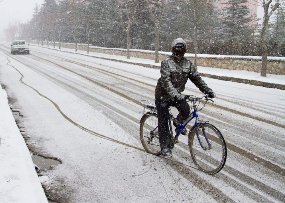Winter Cyclist Snowy Road by Feyzullah Tunç — canvas wall art