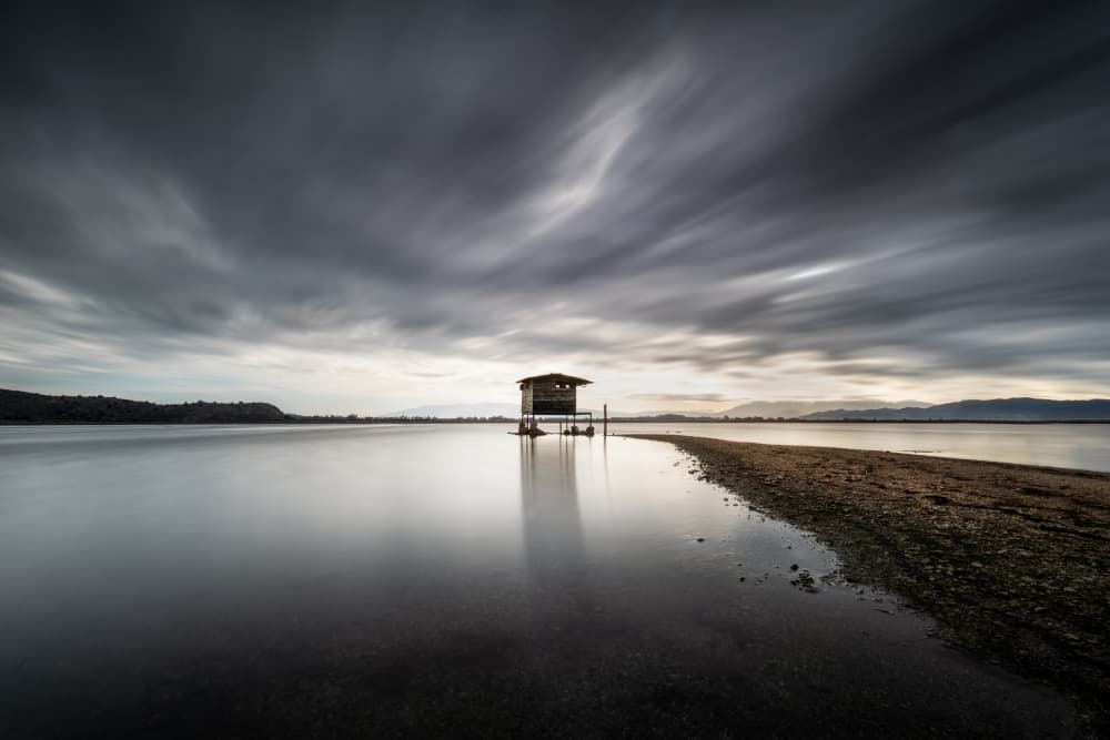 Moody Waterside Retreat by George Digalakis — canvas wall art