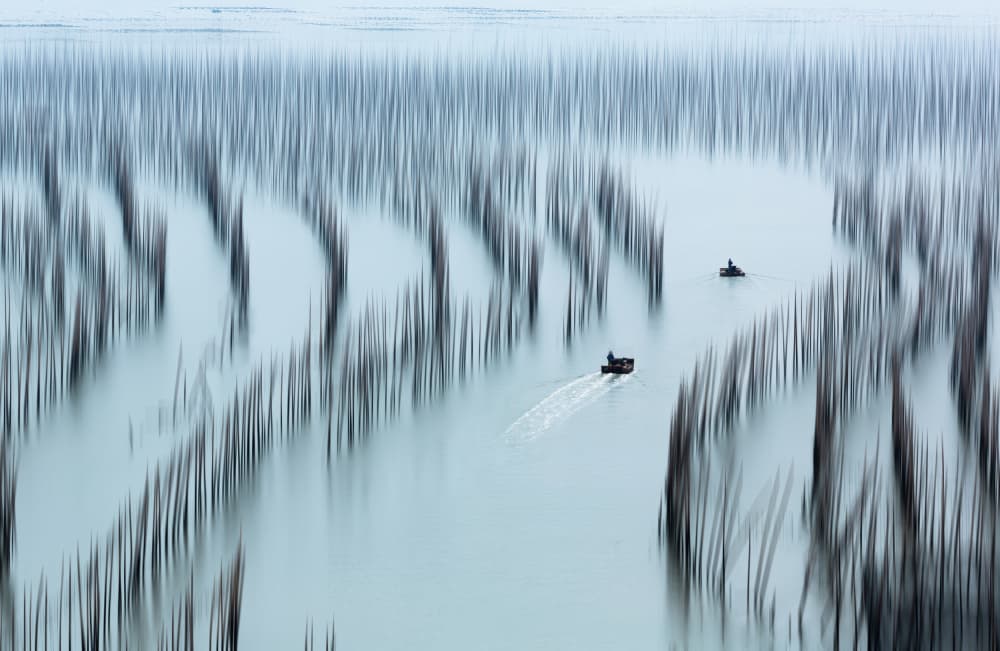 Misty Sea Boats Poles by Jie Jin — canvas wall art