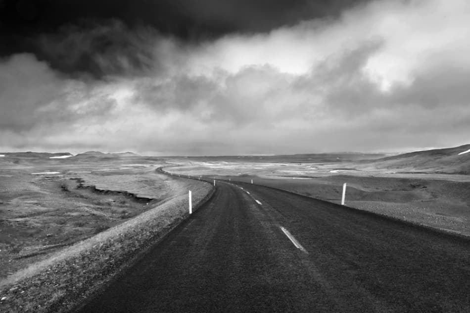 Winding Road Under Dramatic Sky by Jure Kravanja — canvas wall art