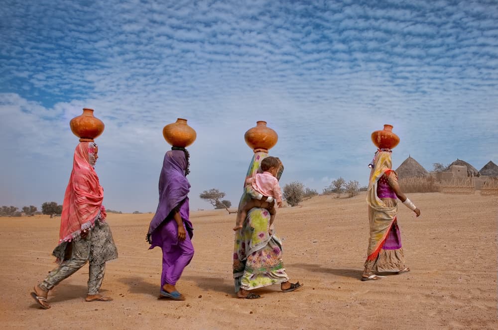 Women Carrying Water Pots by Sayyed Nayyer Reza — canvas wall art