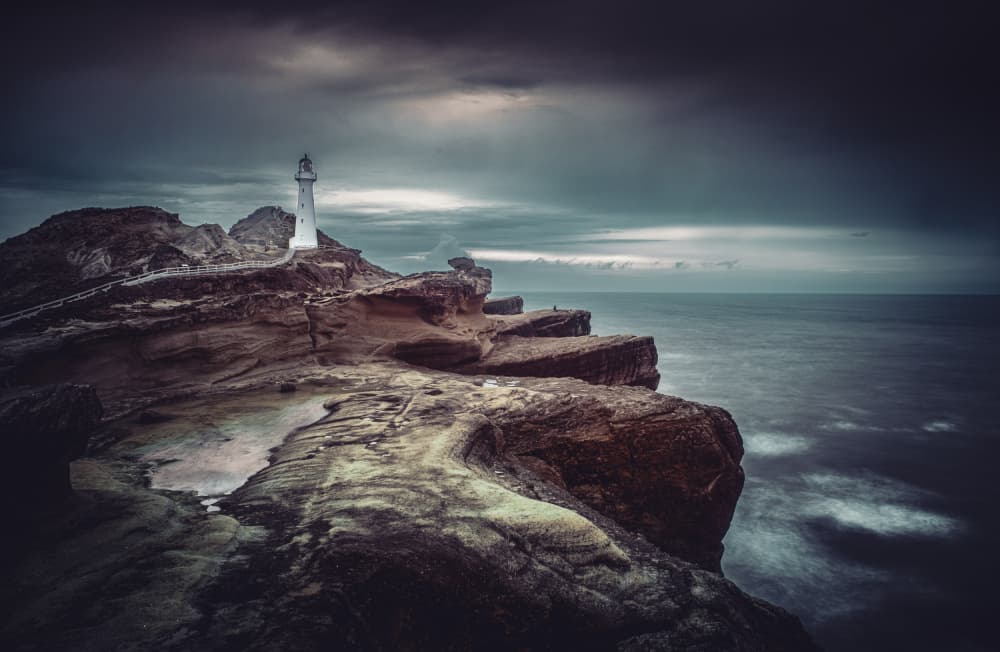 Lighthouse on Moody Cliffs by Andrea Auf dem Brinke — canvas wall art