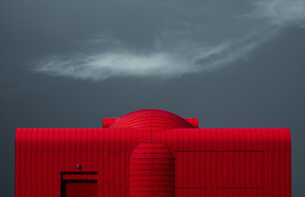 Red Building Dark Sky by Harry Verschelden — canvas wall art