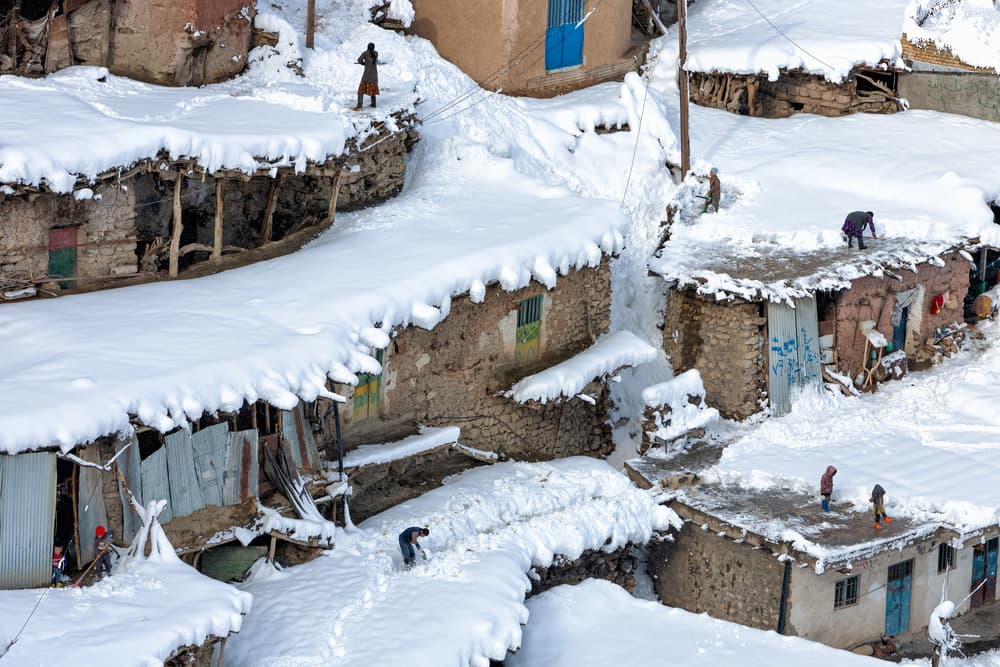 Snowy Village Daily Life by Mohammadreza Momeni — canvas wall art