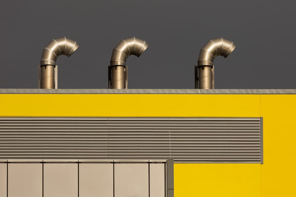 Industrial Yellow Vents by Jacqueline Hammer — canvas wall art