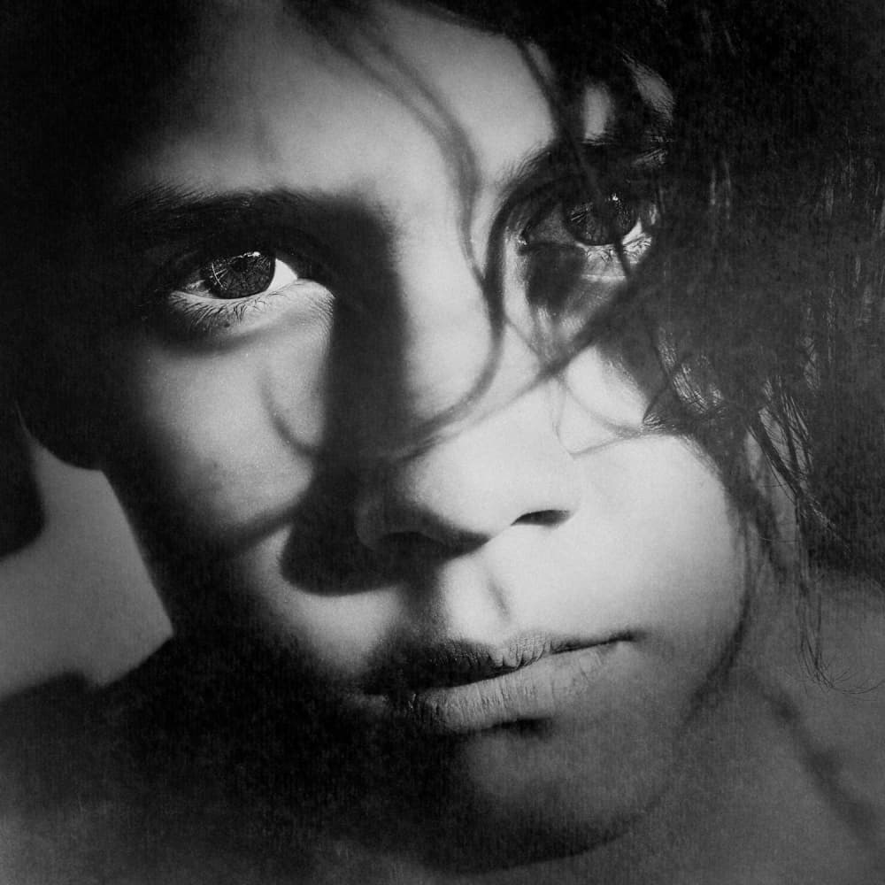 Young Face In Shadow by Bez Dan — canvas wall art