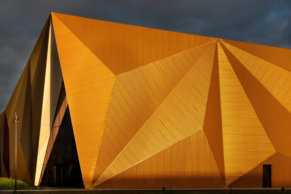 Golden Geometric Building by Theo Luycx — canvas wall art