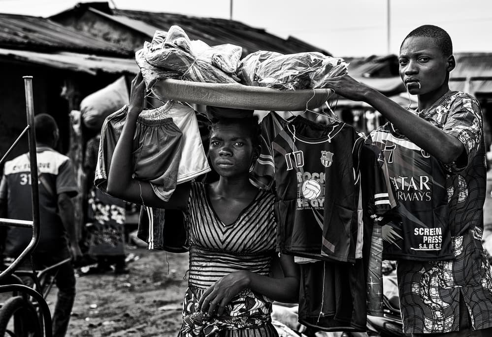 Market Women Selling Clothes by Joxe Inazio Kuesta Garmendia — canvas wall art