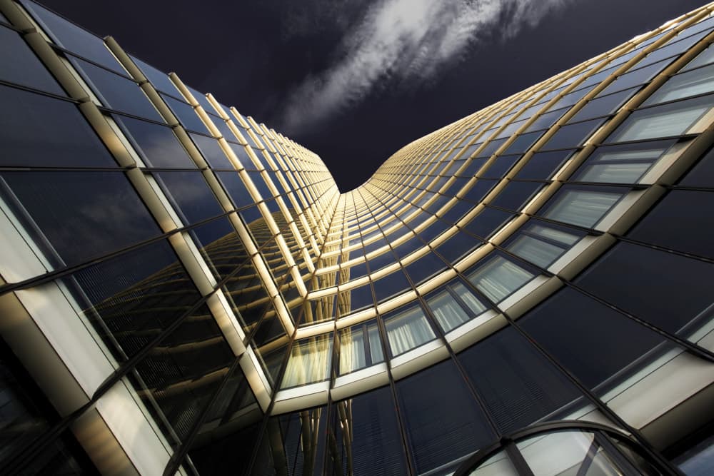 Golden Curved Glass Tower by Erhard Batzdorf — canvas wall art