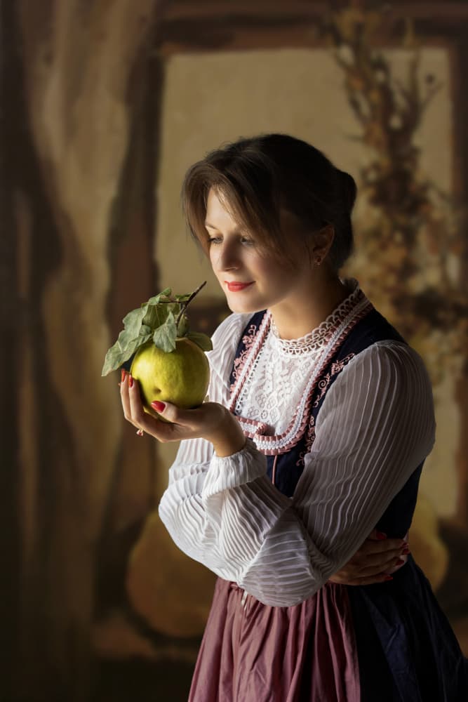 Traditional Woman Holding Quince by Ionel Onofras — canvas wall art