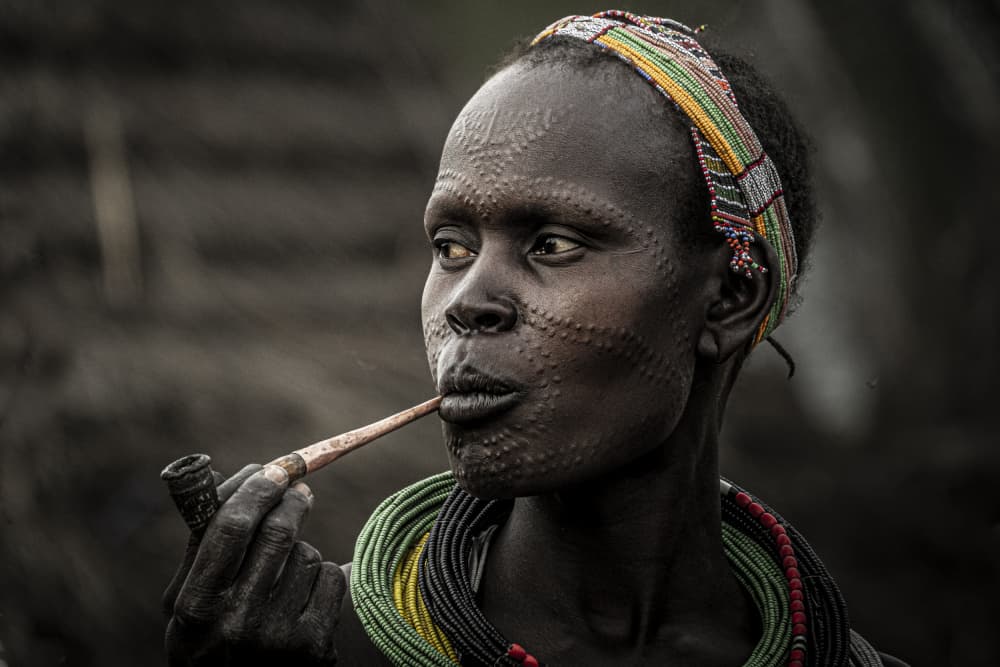Tribal Woman Smoking Pipe by Elena Molina — canvas wall art