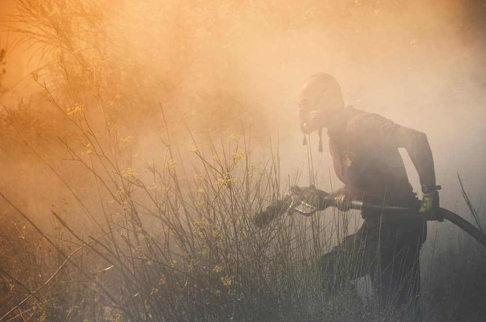 Firefighter In Orange Smoke by Antonio Grambone — canvas wall art