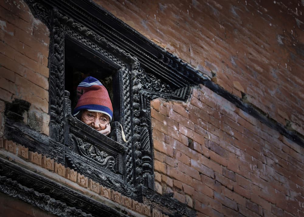 Woman At Carved Window by Irene Perovich — canvas wall art