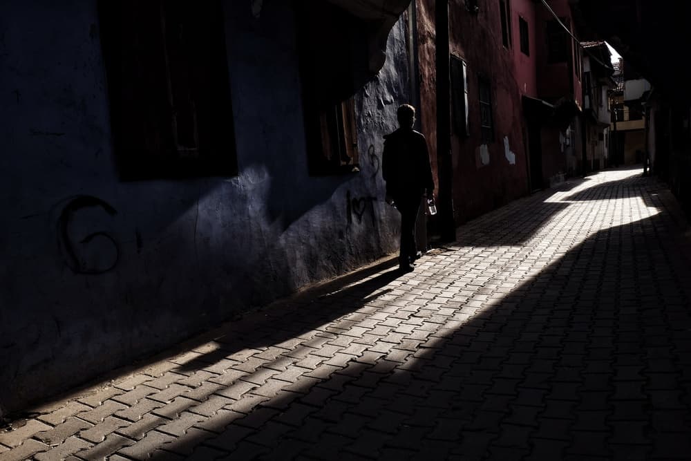 Solitary Figure in Dramatic Light by Ali Ayer — canvas wall art