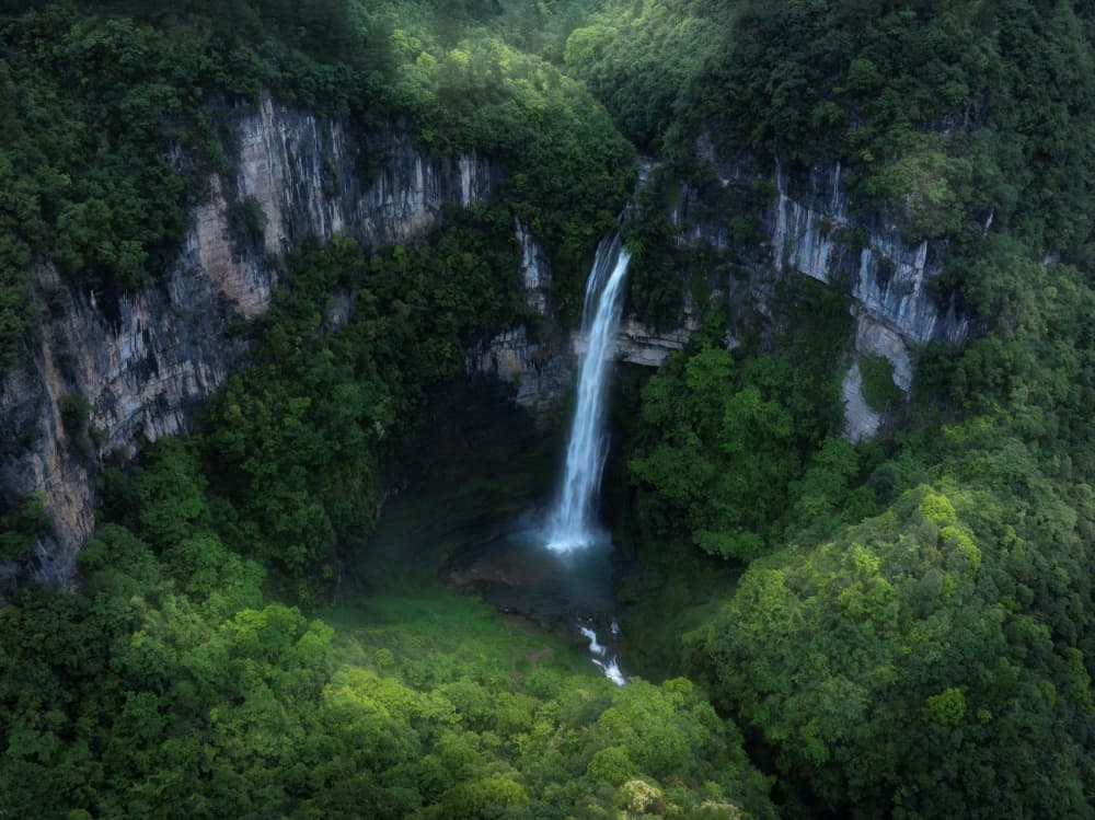 Lush Valley Waterfall by Simoon — canvas wall art