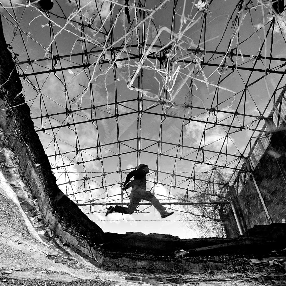 Man Leaping Through Ruin by Carlo Ferrara — canvas wall art