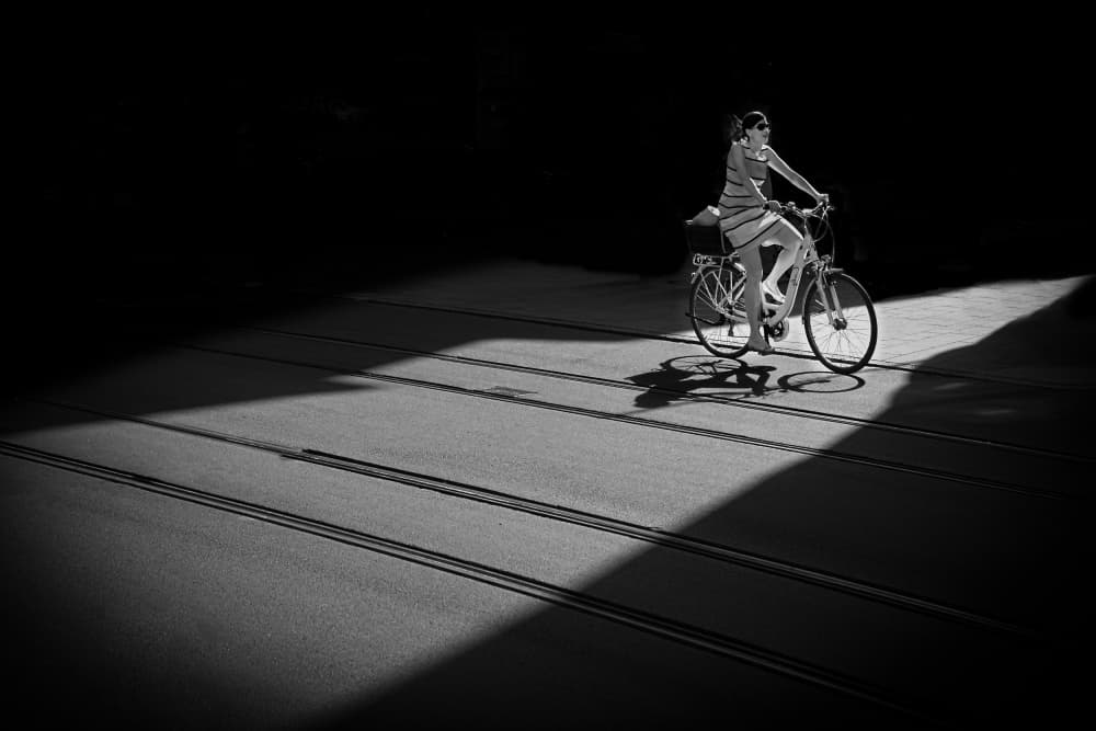 Urban Cyclist Shadows by Rolf Endermann — canvas wall art