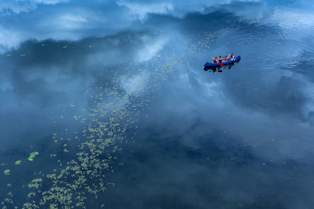 Paddling Through Reflections by Jure Kravanja — canvas wall art