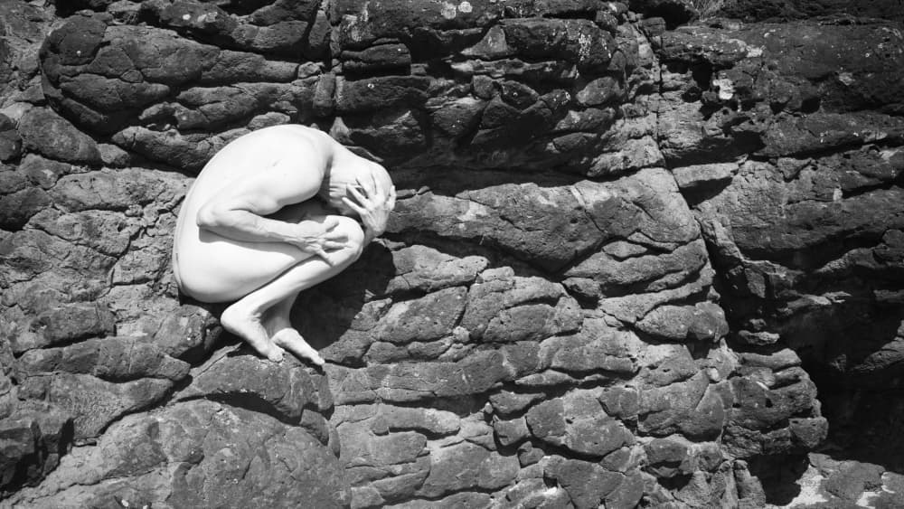 Curled Nude On Rocks by Mel Brackstone — canvas wall art