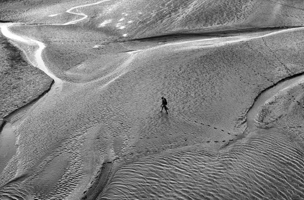 Lone Figure Vast Landscape by Avishek Das — canvas wall art