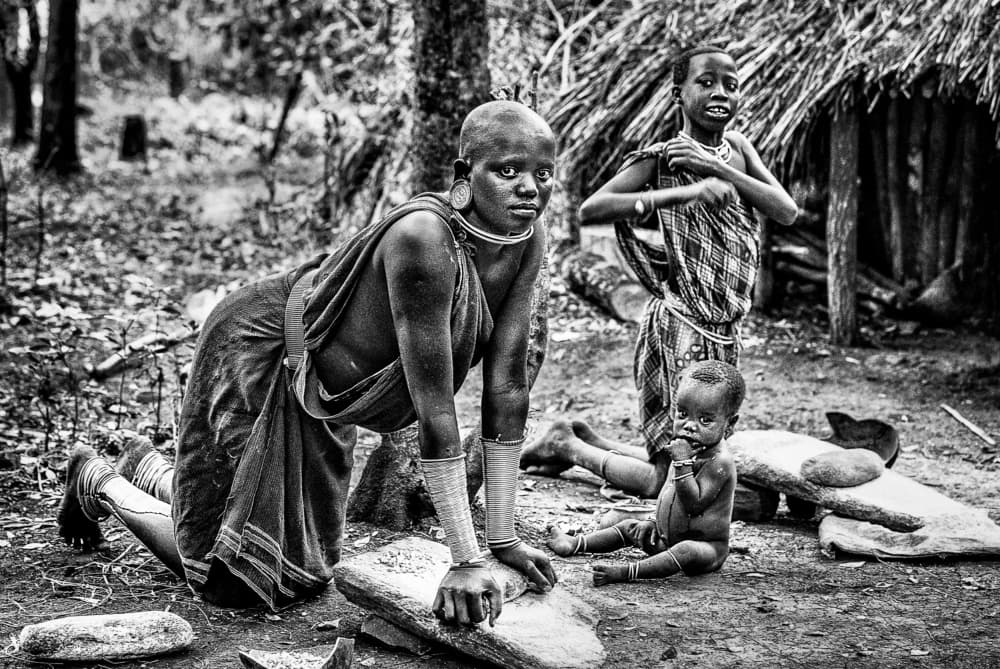 African Village Family by Joxe Inazio Kuesta Garmendia — canvas wall art