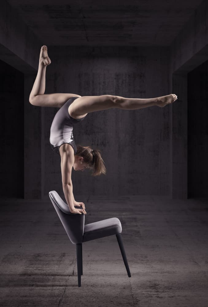 Gymnast Handstand on Chair by Marcel Egger — canvas wall art