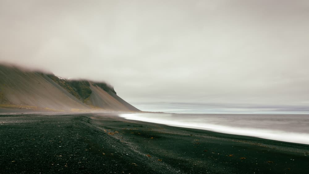 Misty Black Beach Waves by Dieter Reichelt — canvas wall art
