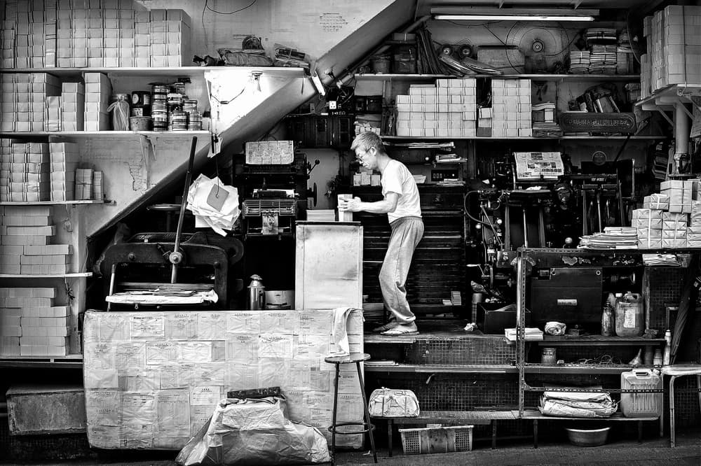 Vintage Print Shop Worker by Joe B N Leung — canvas wall art