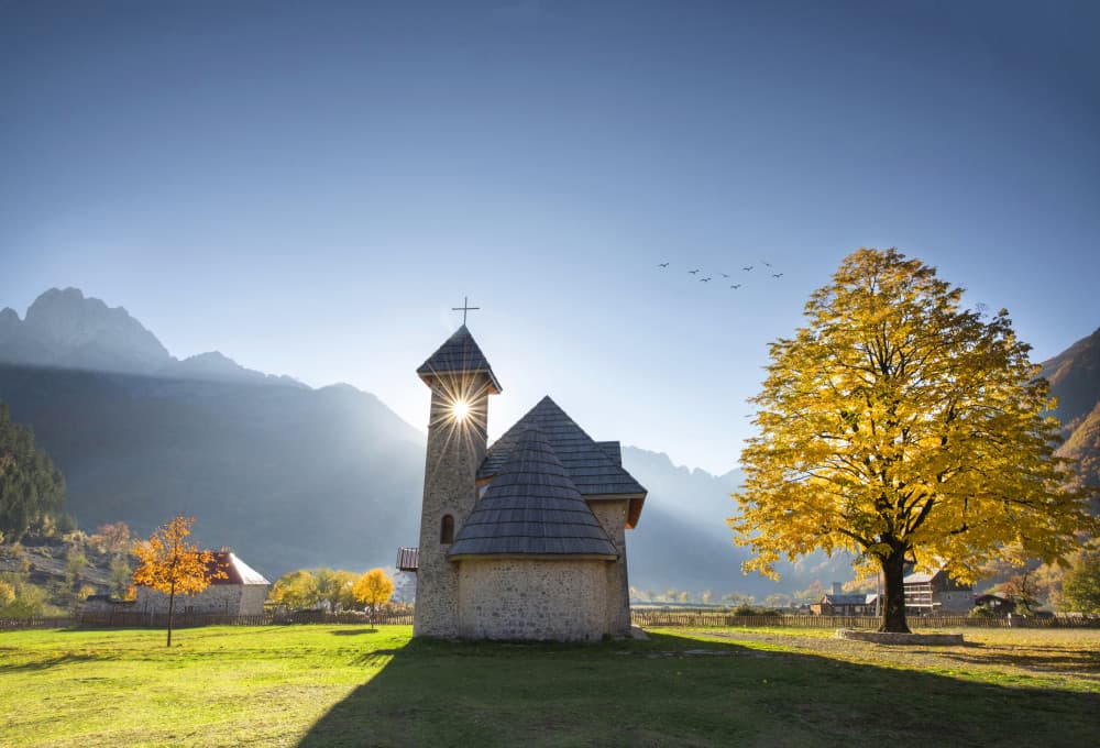 Sunlit Autumn Chapel by Bess Hamiti — canvas wall art