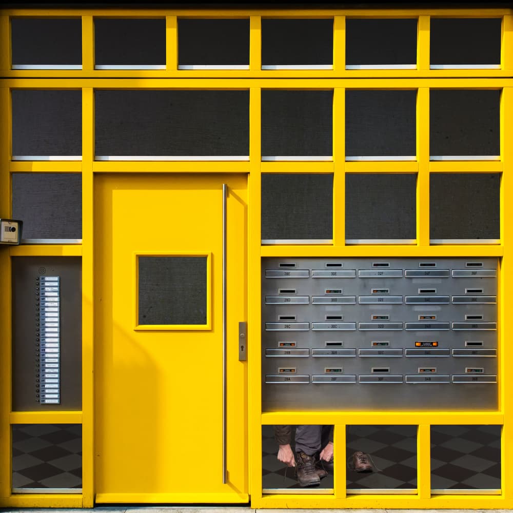 Tying Shoes At Yellow Door by Luc Vangindertael (laGrange) — canvas wall art