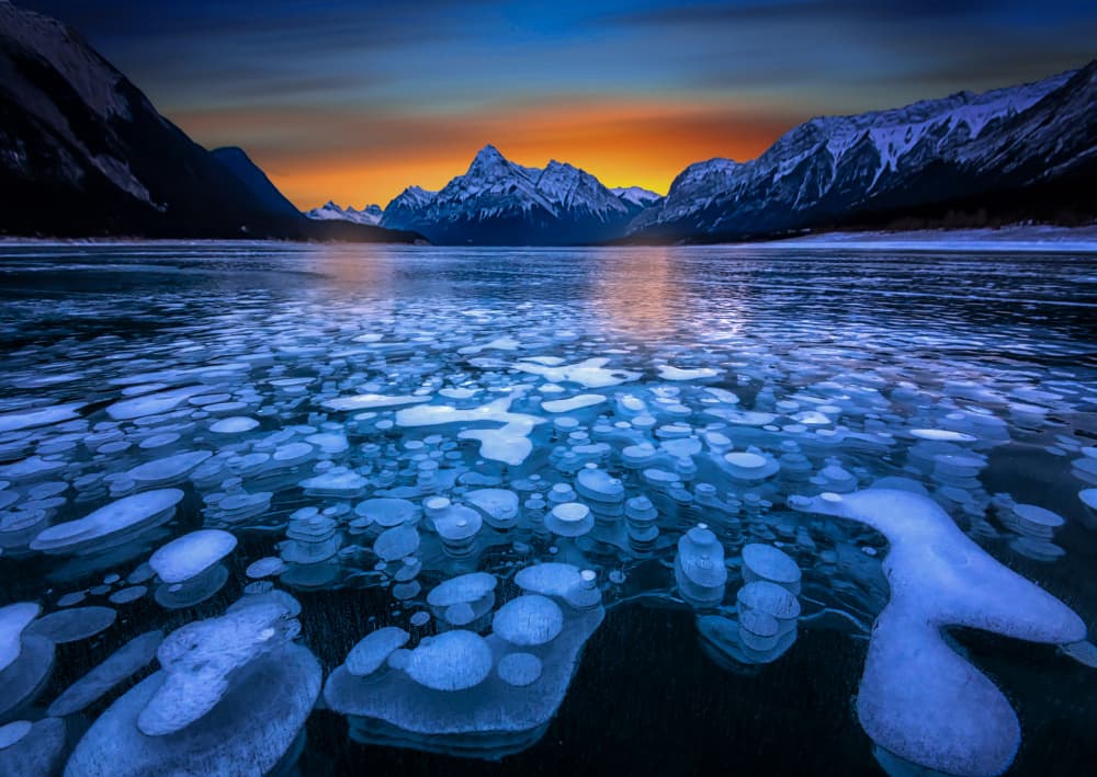 Frozen Lake Mountain Sunset by Jiahong Zeng — canvas wall art