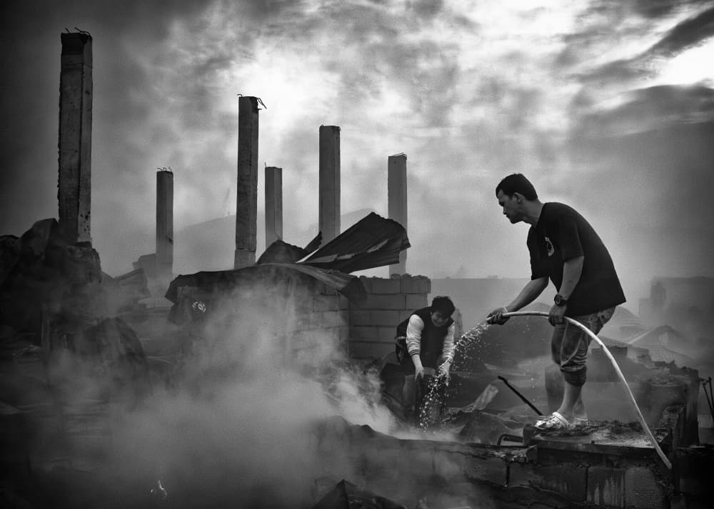 Men Amidst Smoky Ruins by Shinji Isobe — canvas wall art