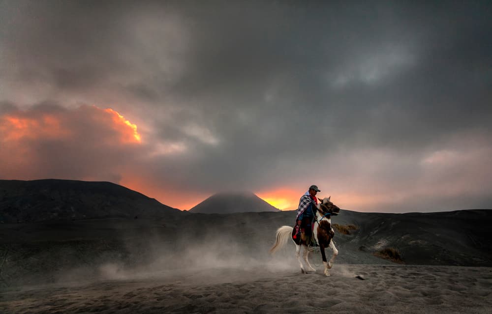 Rider Under Fiery Sky by Arief Siswandhono — canvas wall art