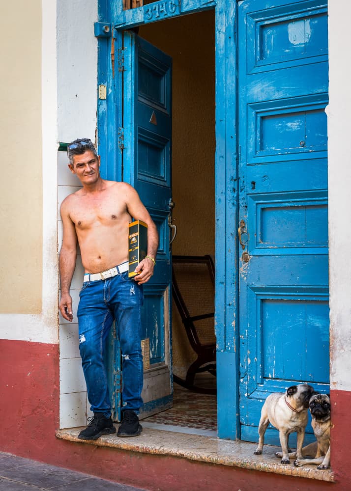 Man Pugs Blue Door by Irene Wu — canvas wall art