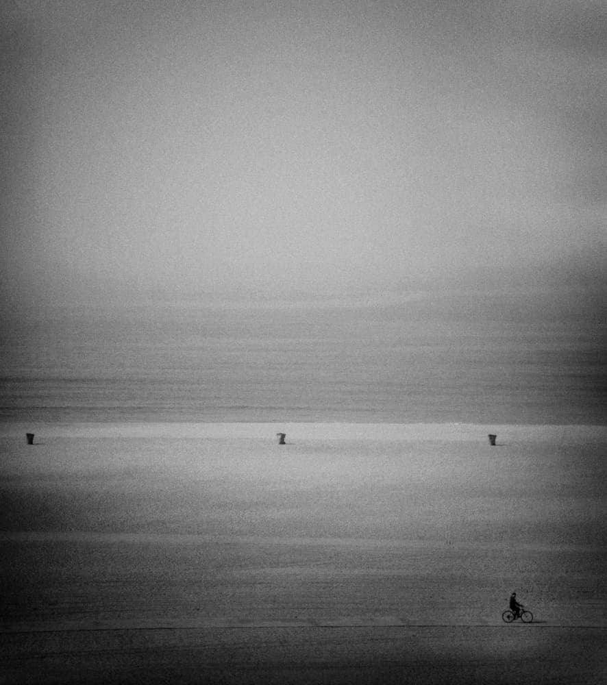 Lone Cyclist Horizon by Roxana Labagnara — canvas wall art