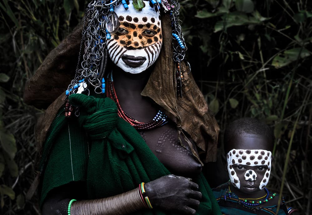 African Painted Faces by Joxe Inazio Kuesta Garmendia — canvas wall art